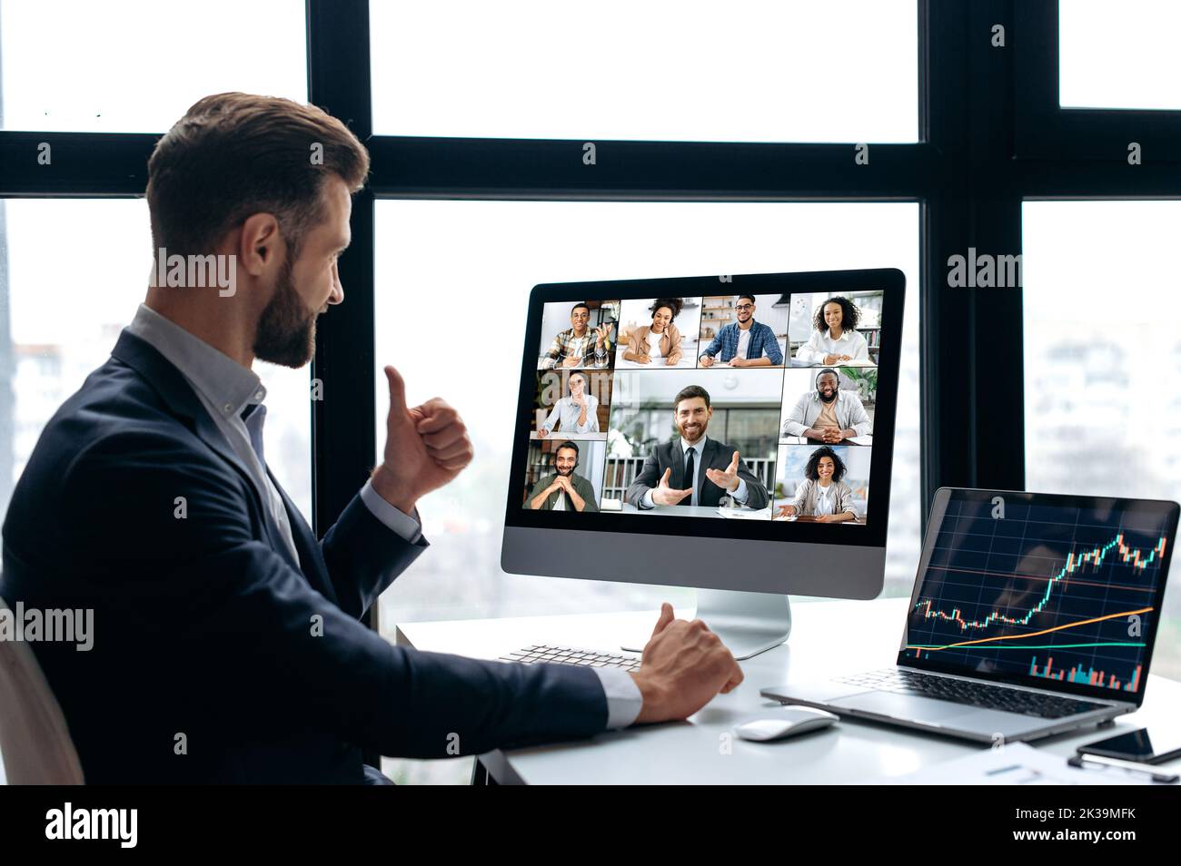 Online video conference. Successful business man, company boss, stock investor, conducts financial brainstorm with group of multiracial partners by video call, discuss investments in the stock market Stock Photo