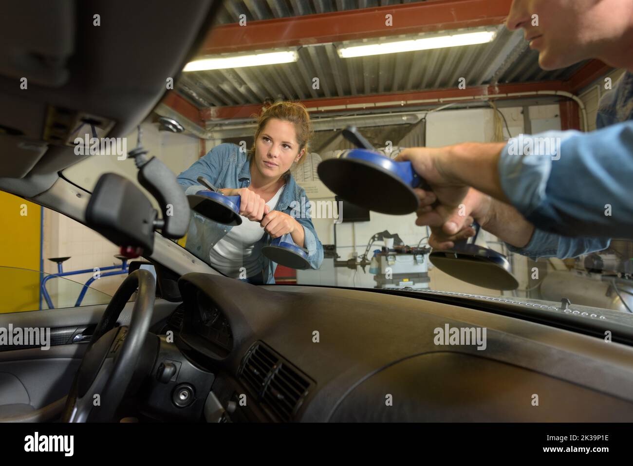 Man and woman repairing windshield of the car stock photo alamy