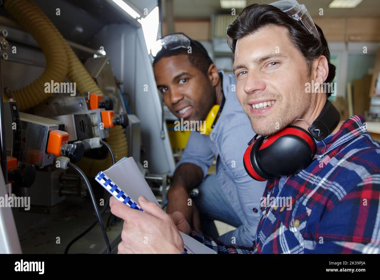 apprentice factory worker learning with happy trade mentor Stock Photo ...