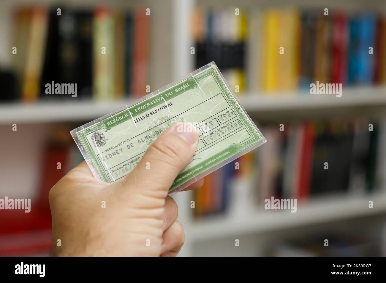 hand holding an electoral card, document used to vote in Brazil Stock Photo