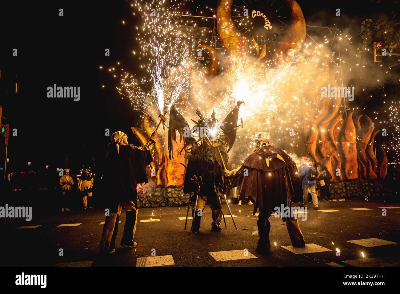 Barcelona, Spain. 25th Sep, 2022. A fire beast gets his stick mounted fire crackers enlightened during the 'correfics' at the Merce Festival of Barcelona. Credit: Matthias Oesterle/Alamy Live News Stock Photo