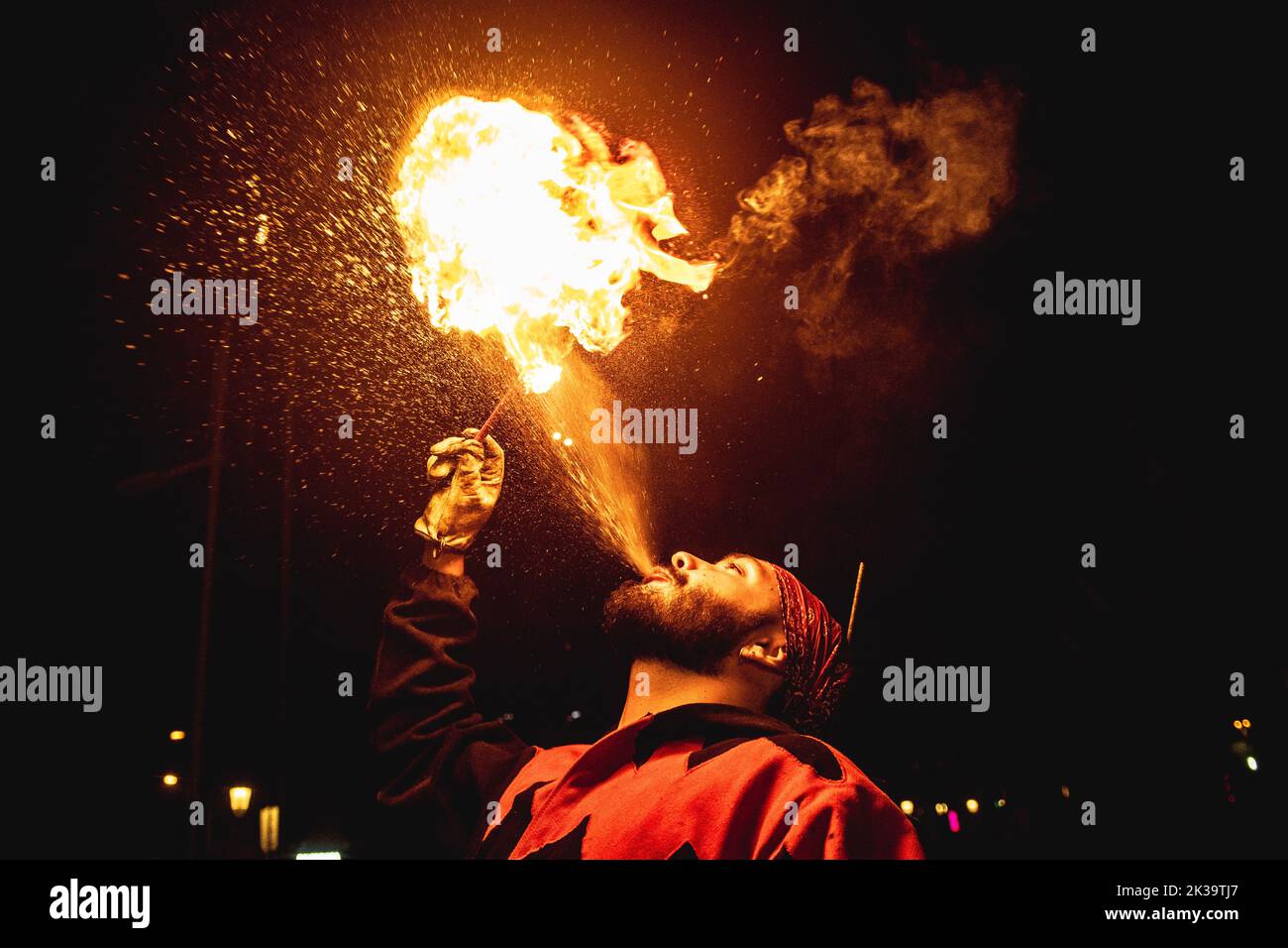 Barcelona, Spain. 25th Sep, 2022. A fire breather blows a fire ball into the night sky during the 'cirrefics' at the Merce Festival of Barcelona. Credit: Matthias Oesterle/Alamy Live News Stock Photo