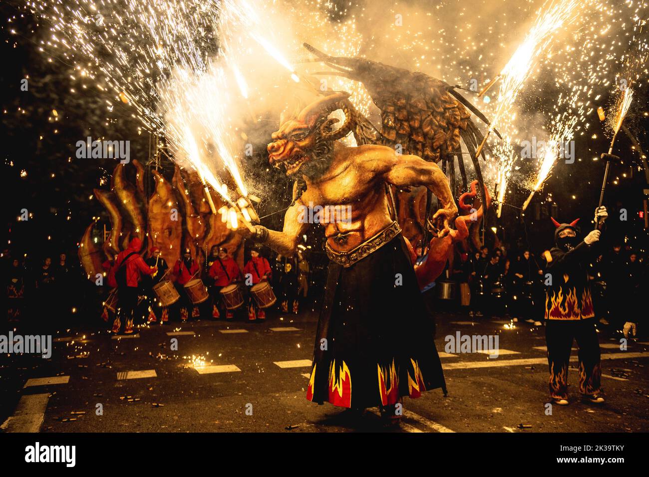 Barcelona, Spain. 25th Sep, 2022. A fire beast sets off his fire crackers during the 'correfics' at the Merce Festival of Barcelona. Credit: Matthias Oesterle/Alamy Live News Stock Photo