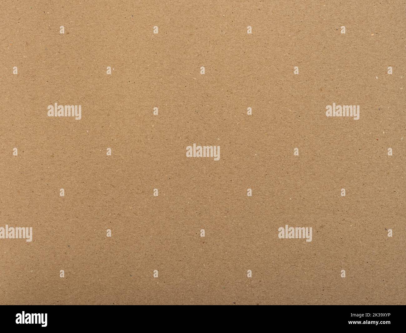 Brown paper texture. Textured background as a blank copy space. Cardboard structure with fine fiber details. Packaging material for a wrapping purpose Stock Photo