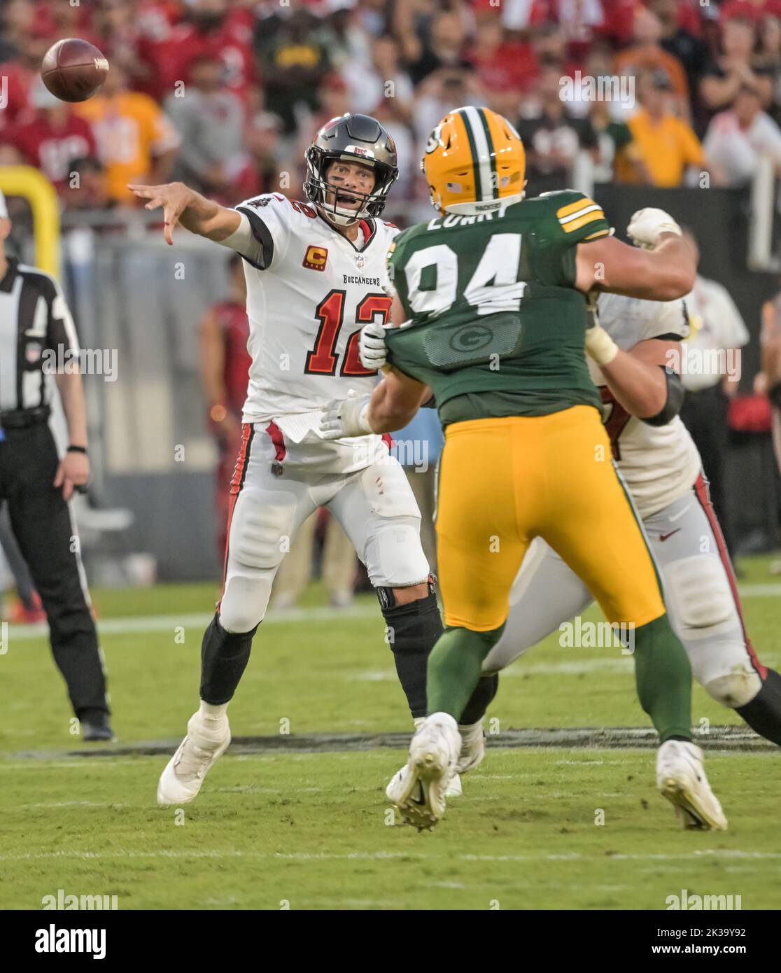 Tampa, United States. 25th Sep, 2022. Tampa Bay Buccaneers quarterback Tom Brady (12) passes under pressure from Green Bay Packers' Dean Lowry (94) during the second half at Raymond James Stadium in Tampa, Florida on Sunday, September 25, 2022. Photo by Steve Nesius/UPI Credit: UPI/Alamy Live News Stock Photo