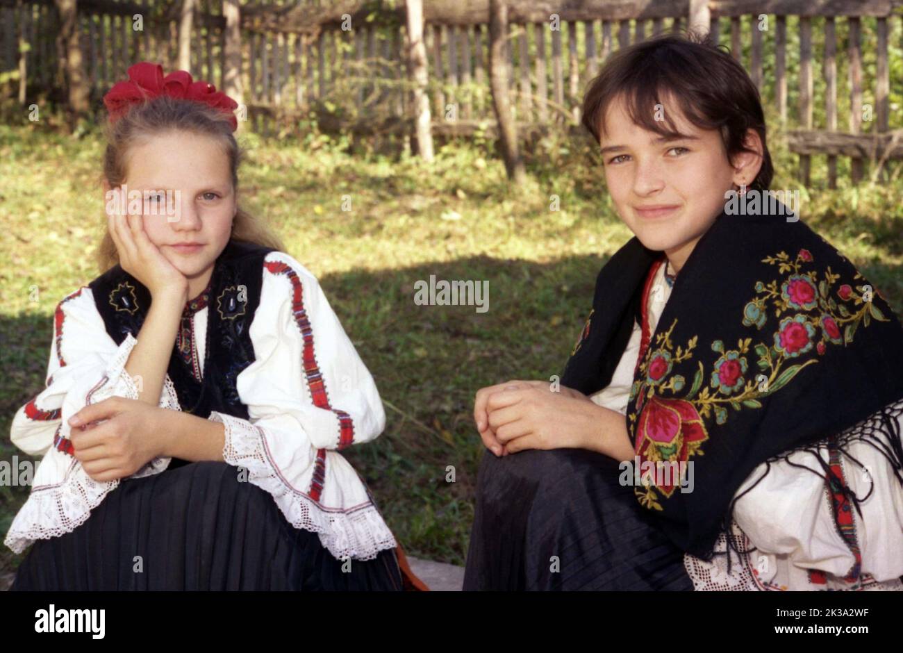 Poșaga, Alba County, Romania, approx. 1999. Young girls wearing authentic traditional clothing. Stock Photo