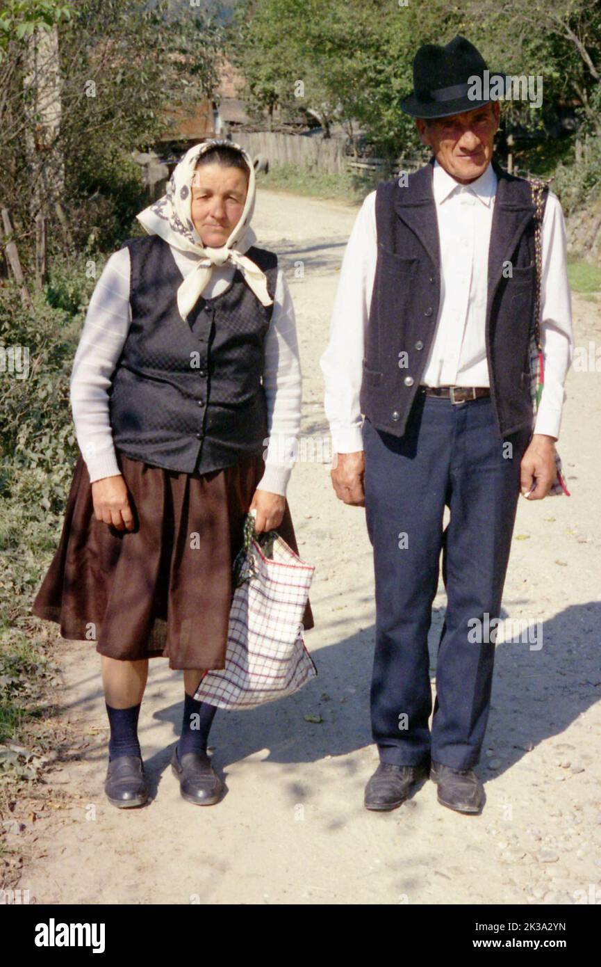 Poșaga, Alba County, Romania, approx. 1999. Elderly couple on the village lane. Stock Photo