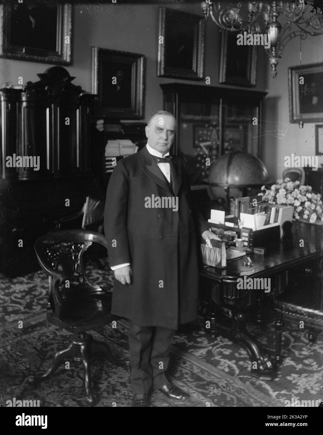 A portrait of US President William McKinley at his desk in the Treaty Room of the White House. McKinley was the 25th president of the USA, and the third of four to be assassinated. He was shot by Leon Czolgosz on 6th September 1901. Like James Garfield, McKinley briefly recovered from the wounds, to die of sepsis some time later. In this engraving he is seen as a presidential candidate. Stock Photo