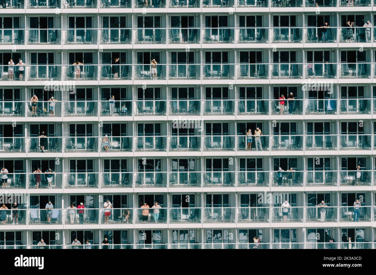 People looking out from their cabins of a modern cruise ship in Vigo, Spain Stock Photo
