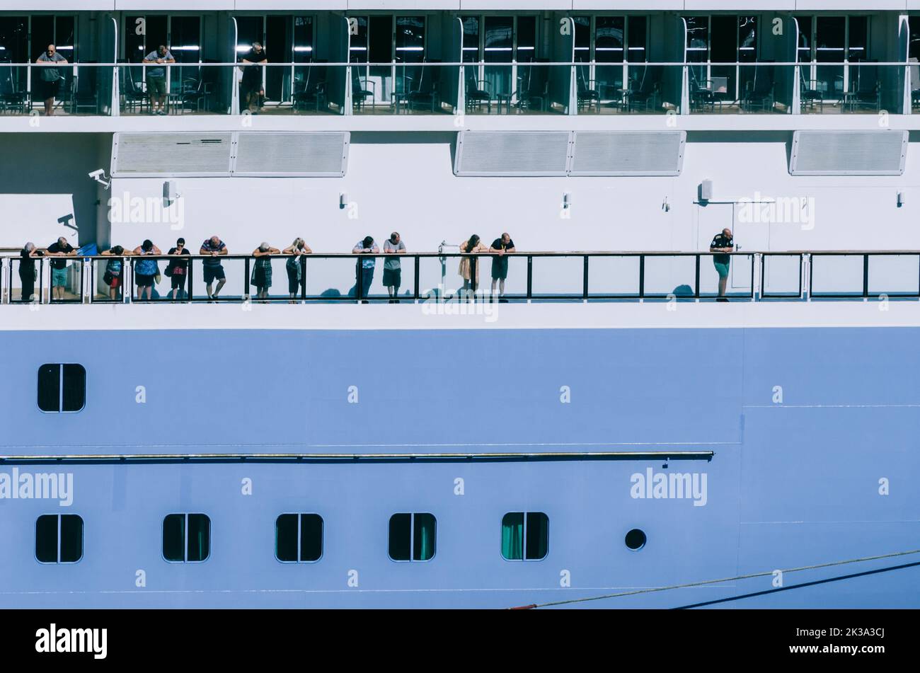 Vigo, Spain - Sept 25, 2022: People looking out from the deck of a modern cruise ship in Vigo, Spain Stock Photo
