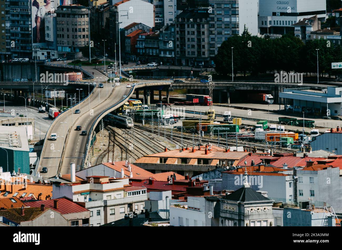 Vigo, Spain - September 25, 2022: Busy intersection and railway crossing in Vigo, Spain Stock Photo