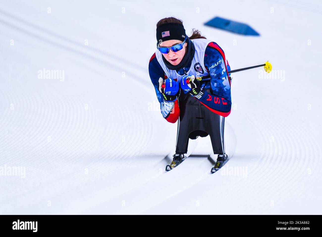 Athlete Kendall Gretsch tucks a downhill at the 2019 U.S. Paralympic National Cross Country Ski Championships at Craftsbury Outdoor Center, VT, USA. Stock Photo