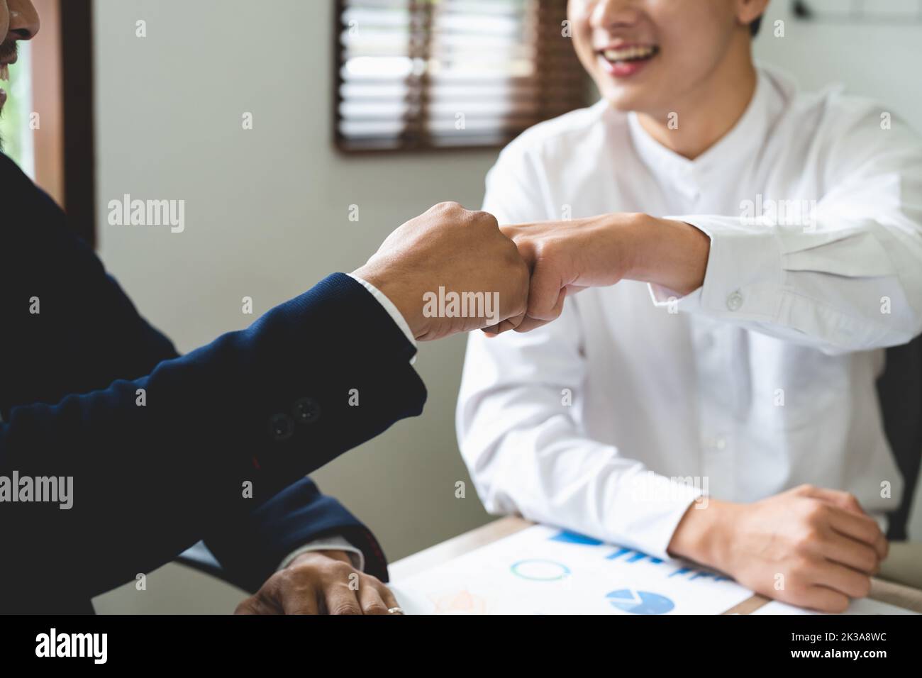 Business people showing Fist Bump after meeting partnership. Teamwork Concept. Stock Photo