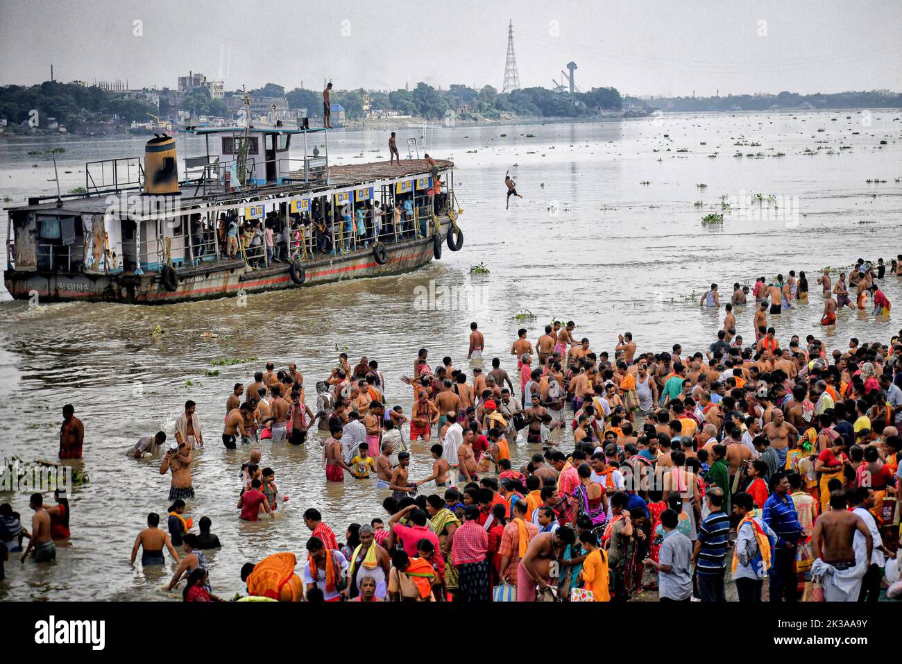 Devotees seen in River Ganges during the Mahalaya celebration. Mahalaya