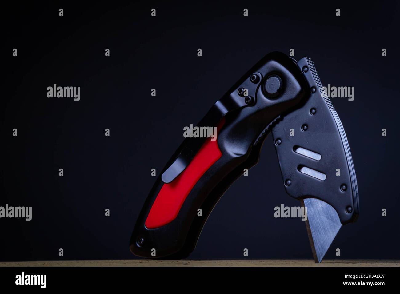 Universal powerful knife. Folding tool that cuts paper, plastic