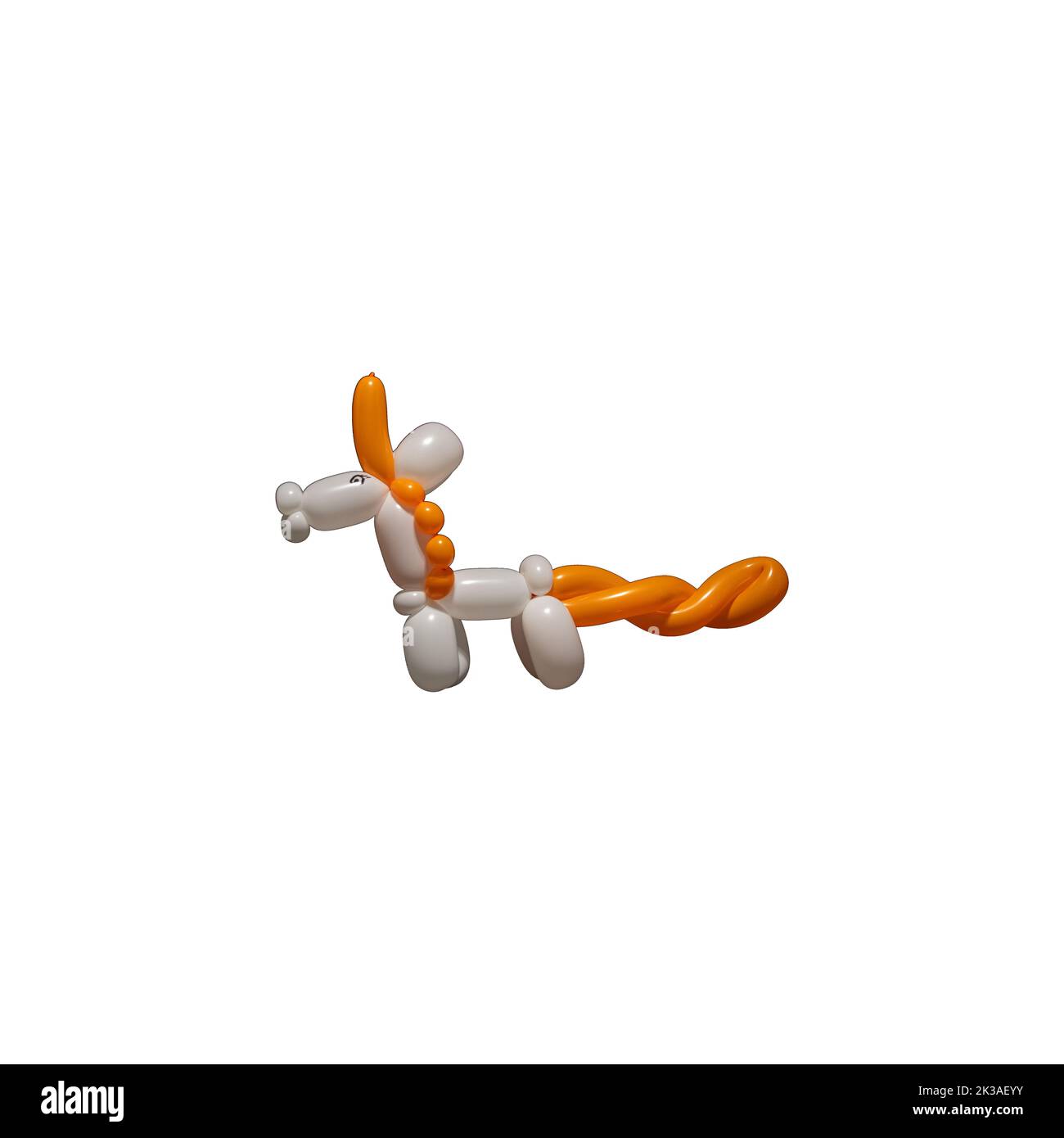 A cute white unicorn balloon animal with an orange mane, tail and horn like a clown or entertainer might make at a birthday party or event using ballo Stock Photo