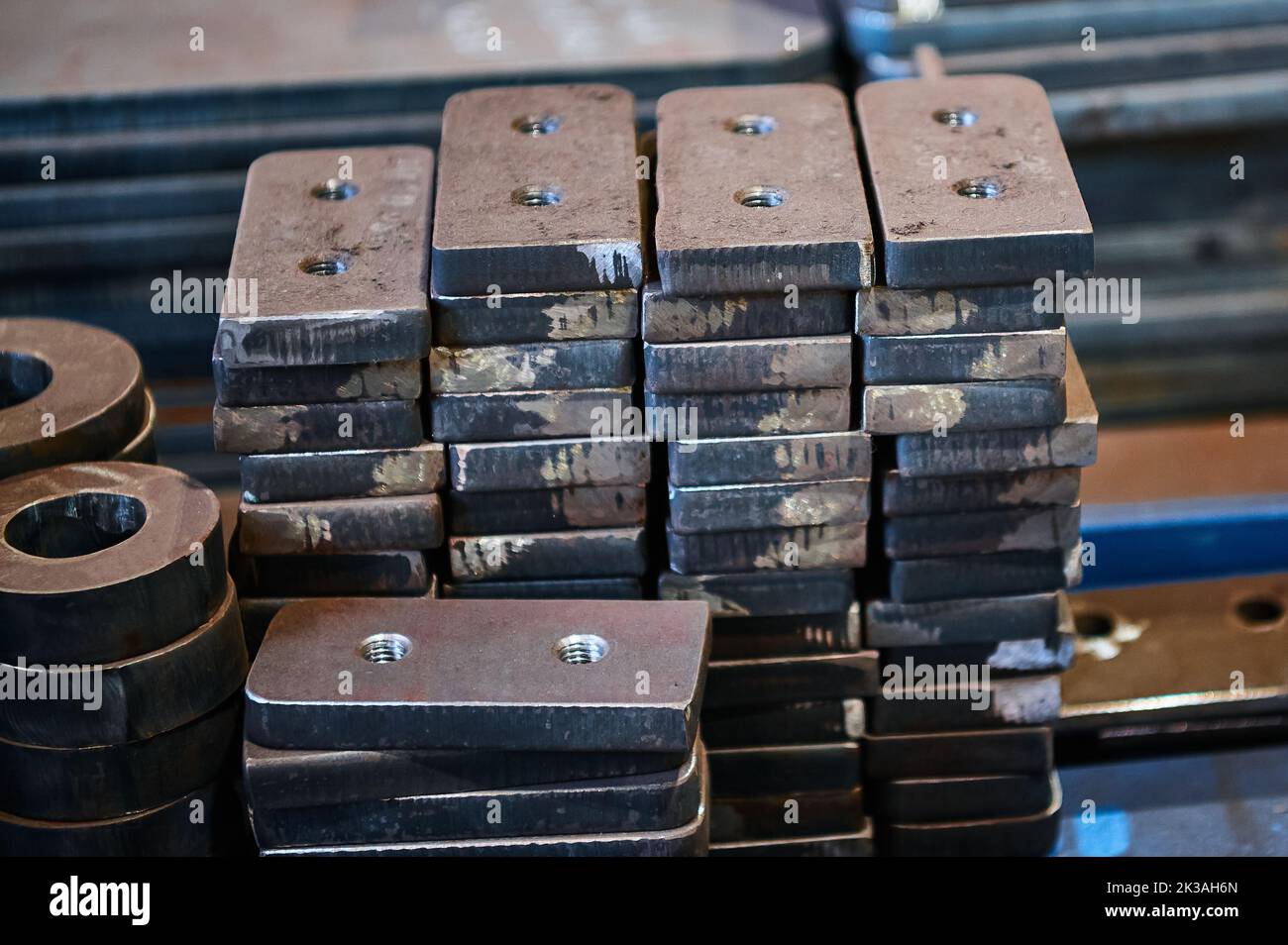 Piles of different workpieces made of metal material sheet Stock Photo Alamy