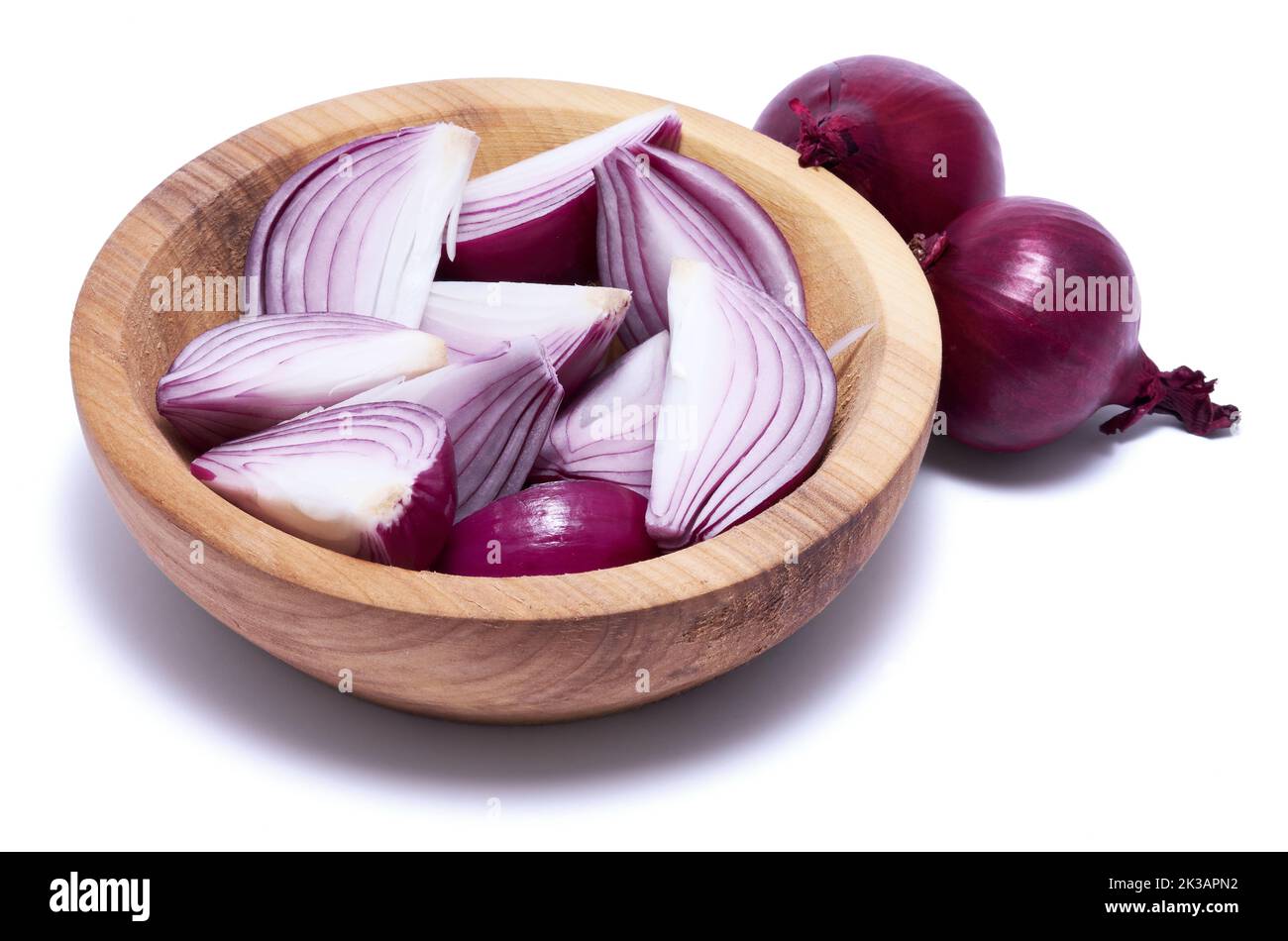 Sliced Red Onion in wooden bowl isolated on white background Stock ...