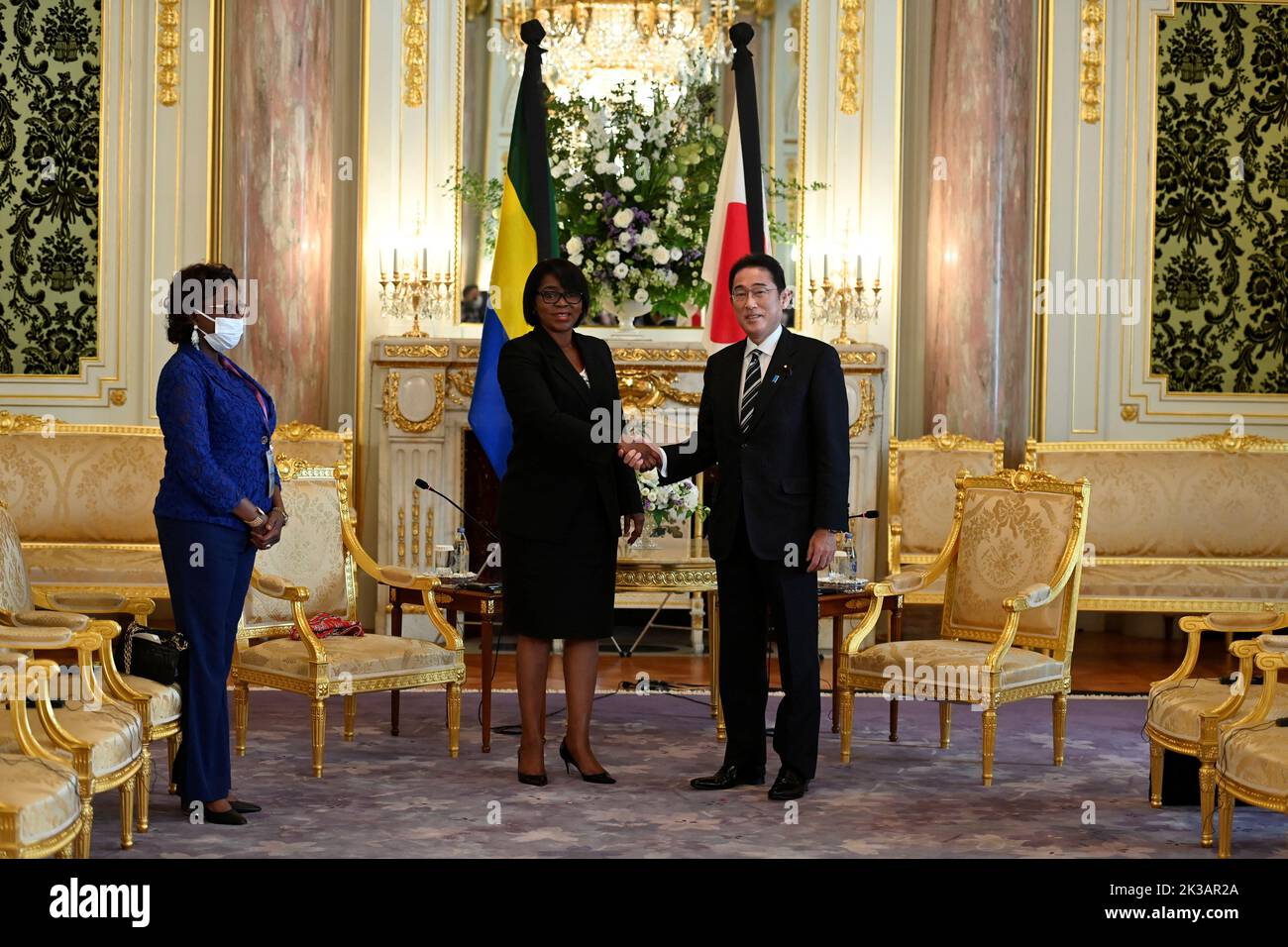 TOKYO, JAPAN - SEPTEMBER 26 : Prime Minister Rose Christiane Ossouka Raponda, Republic of Gabon, with Japan's Prime Minister Fumio (R) pose for photographers prior to the Japan-Gabon Summit Meeting at Akasaka Palace State Guest House in Tokyo, Japan on September 26, 2022 in Tokyo, Japan. Prime Minister Rose Christiane Ossouka Raponda and Moussa Adamo, Minister of Foreign Affairs, Republic of Gabon, are visiting Japan within the state funeral for former Prime Minister Shinzo Abe that will be held on September 27 in the capital of Japan. David Mareuil/Pool via REUTERS Stock Photo