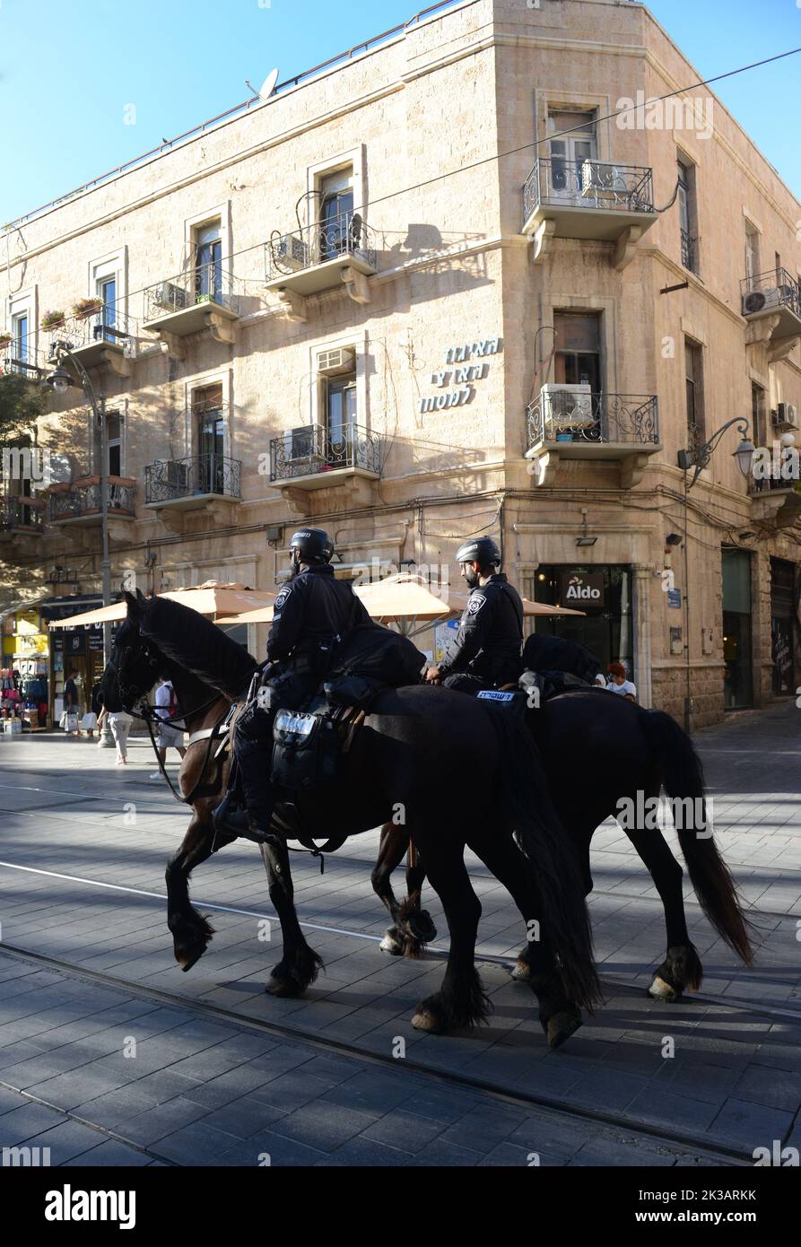 Horse mounted Israeli security forces patrolling Jaffa street in the city center of Jerusalem, Israel. Stock Photo