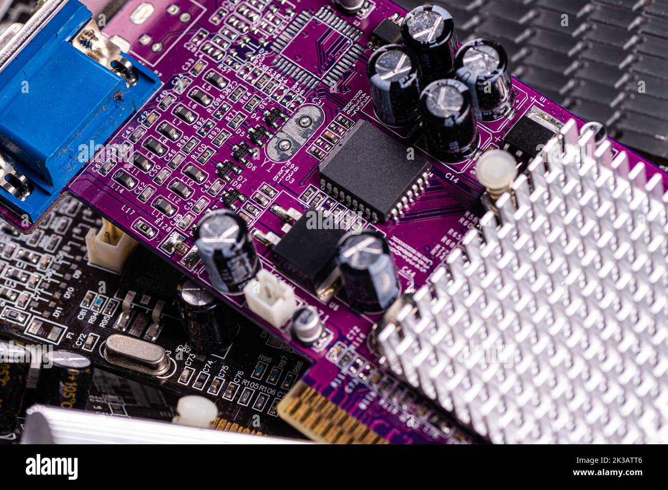 electronic circuit and cooling fin at computer video card, stack with used video cards, close-up Stock Photo