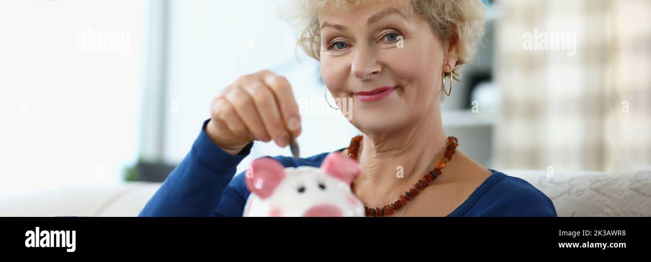 Elderly woman puts coin in hi-res stock photography and images - Alamy