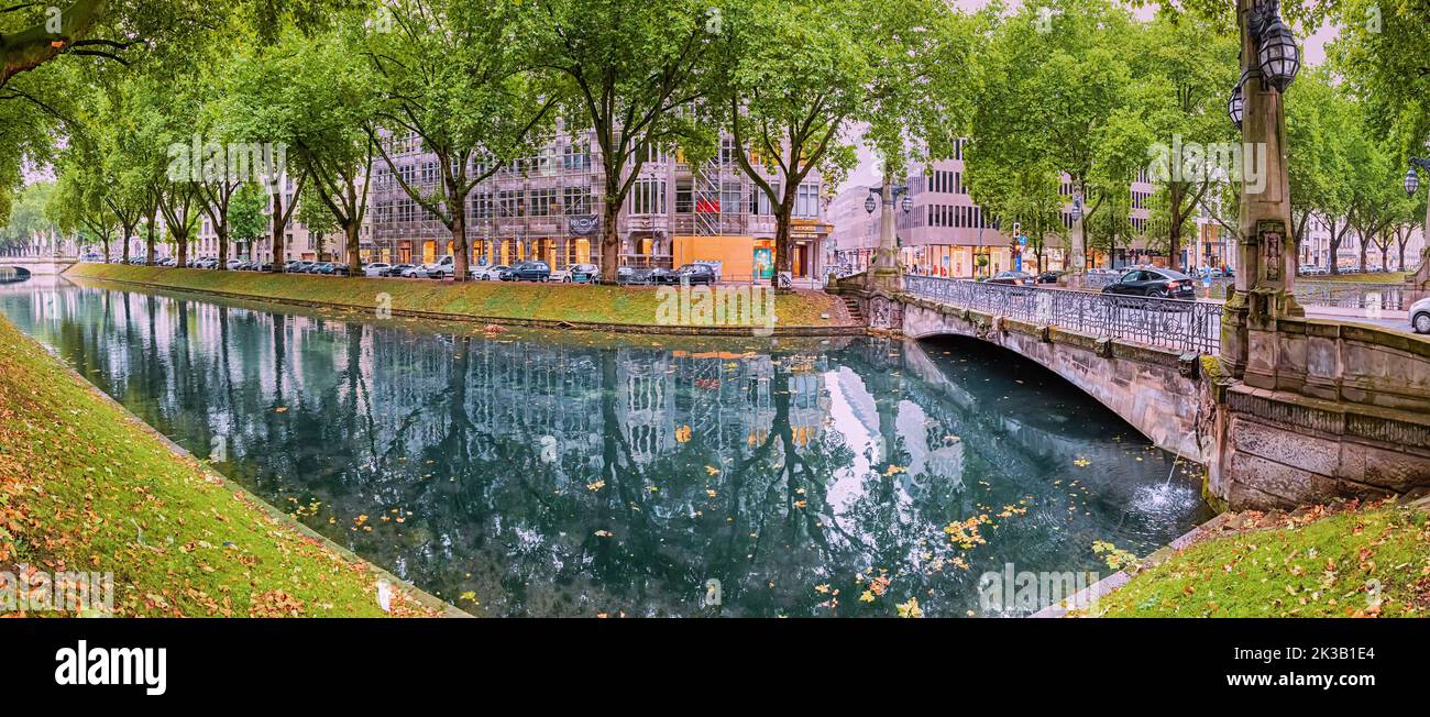 21 July 2022, Dusseldorf, Germany: Koenigsallee - a popular tourist and historical attraction of the city of Dusseldorf in Germany. A canal planted wi Stock Photo