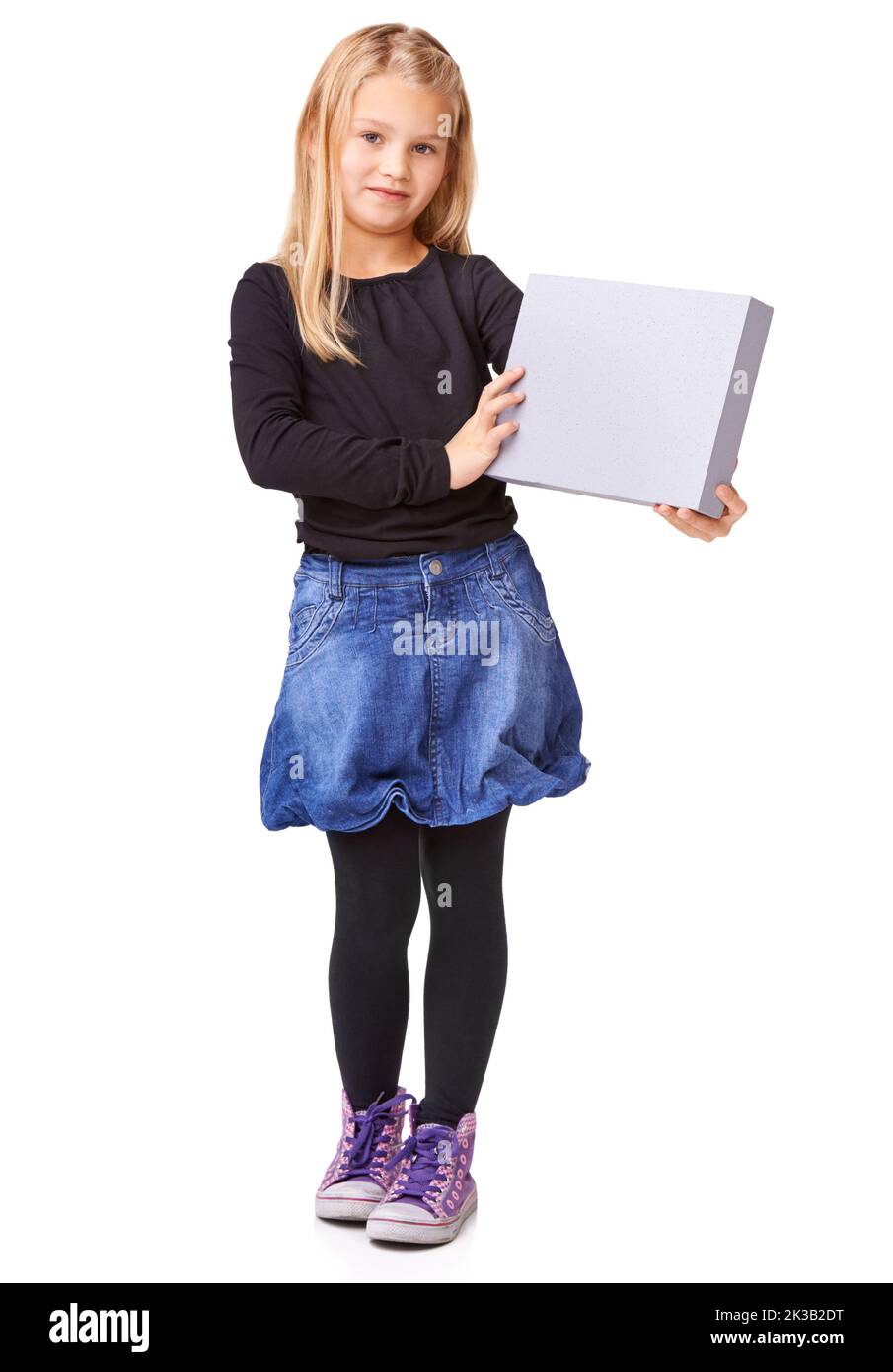 Every kid deserves this...Studio shot of a young girl holding up a blank sign for copyspace. Stock Photo