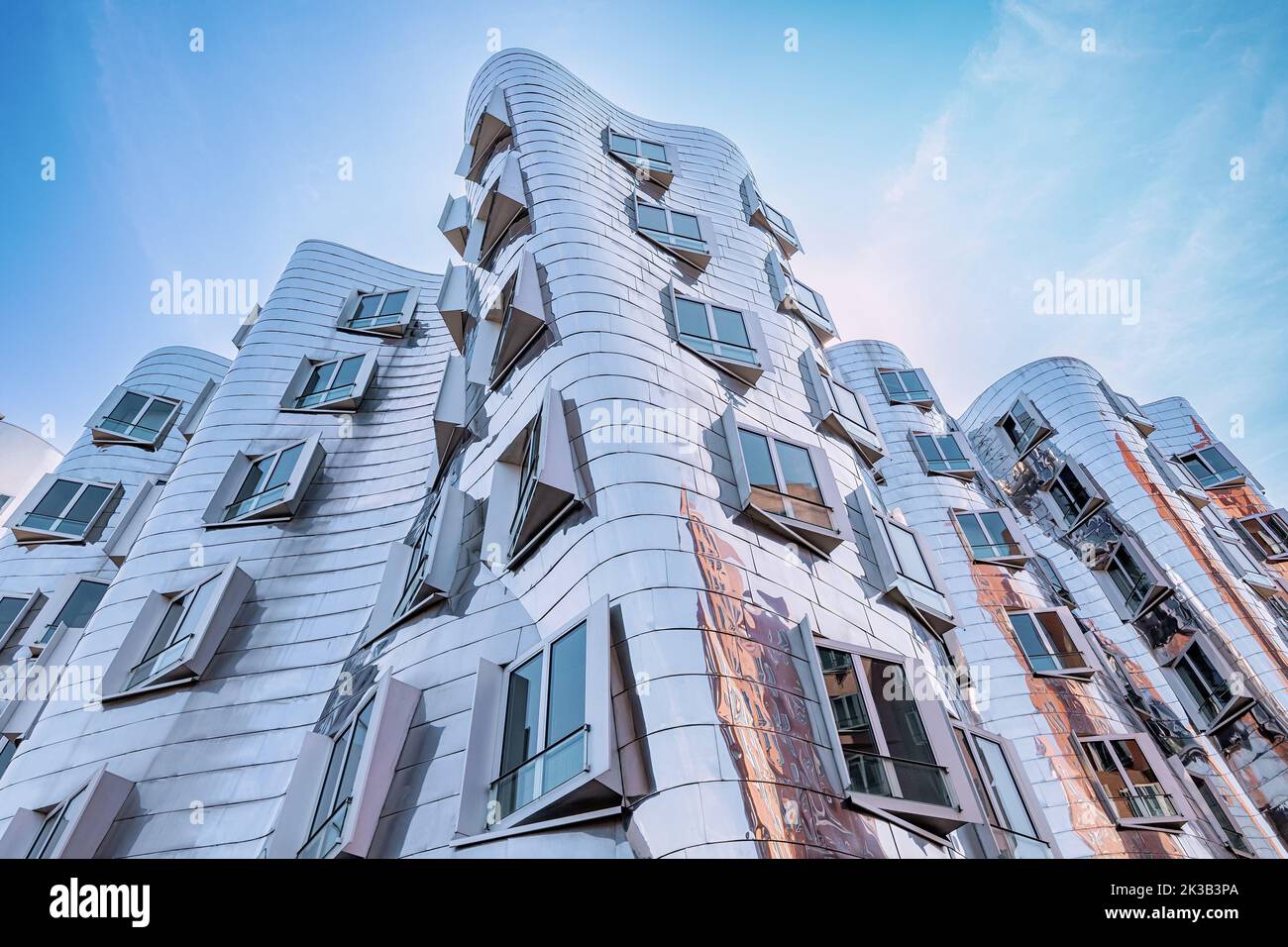 23 July 2022, Dusseldorf, Germany: Gehry Bauten or Zollhof unusual modern architecture buildings in Media Harbor. Dancing houses and travel attraction Stock Photo