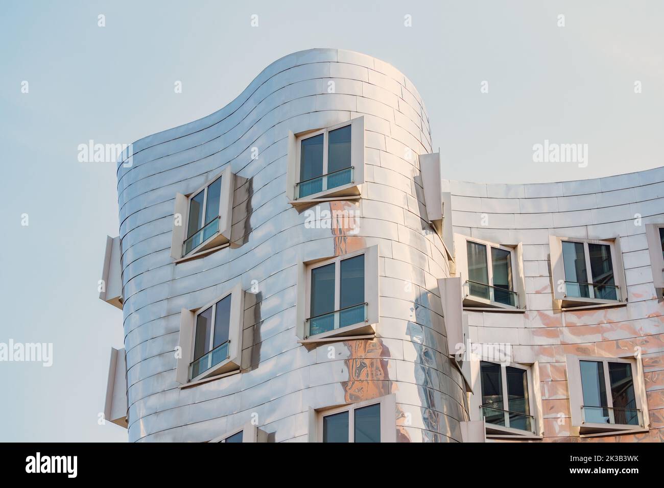 23 July 2022, Dusseldorf, Germany: Detail of Gehry Bauten or Zollhof unusual modern architecture buildings sheathed with metal in Media Harbor. Dancin Stock Photo