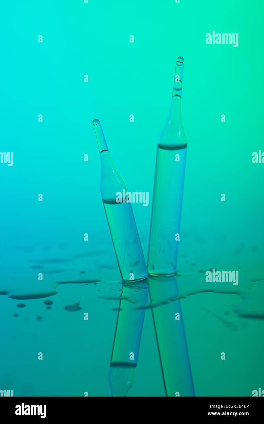 Glass ampules with serum or vitamins Stock Photo