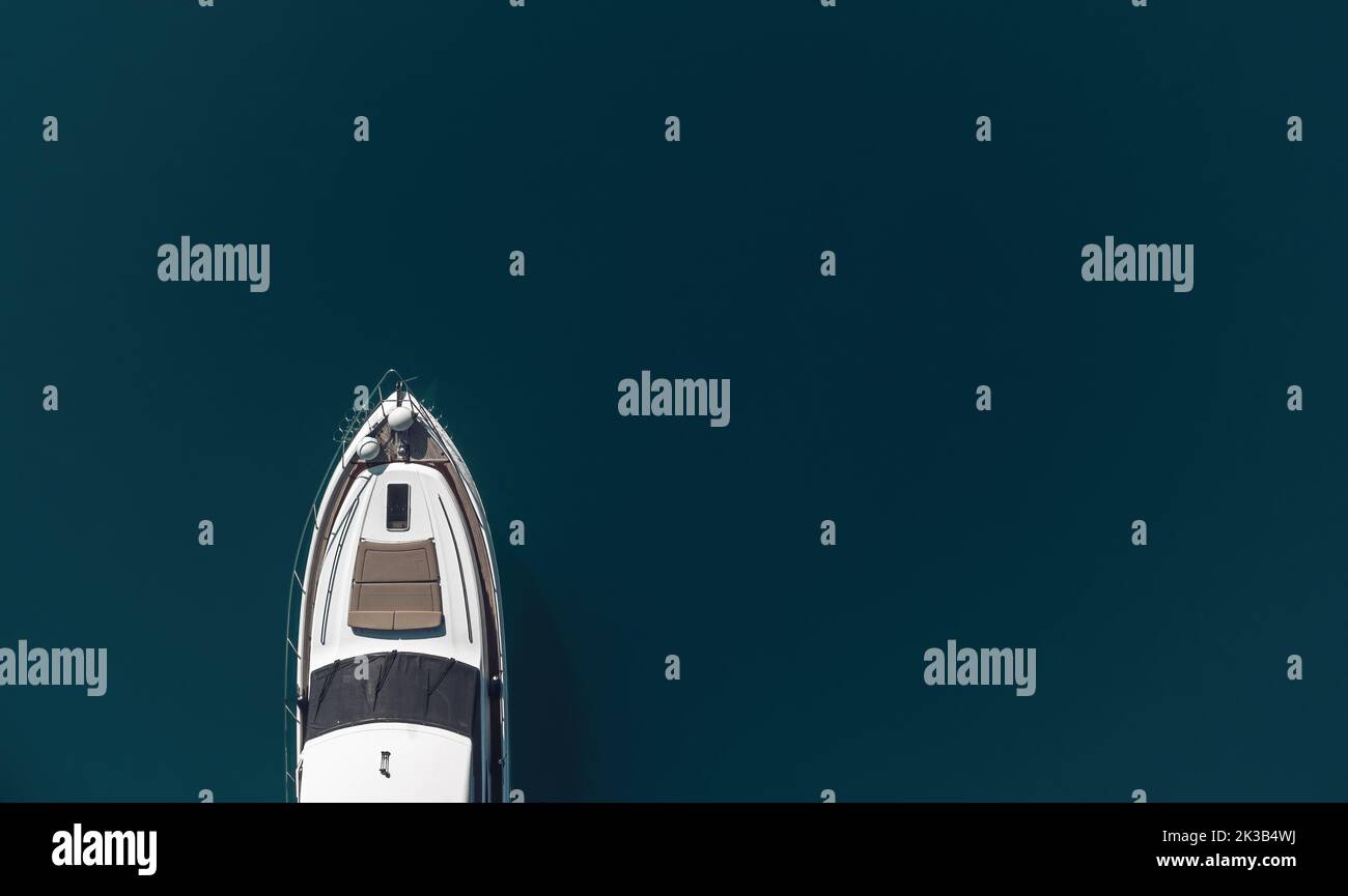 Aerial yacht on calm sea. Luxury cruise trip. View from above of white ...