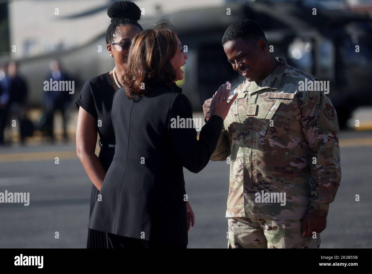 U.S. Vice President Kamala Harris speaks with a U.S. military member after arriving at Yokota Air Base near Tokyo, Japan September 26, 2022.REUTERS/Leah Millis/Pool Stock Photo