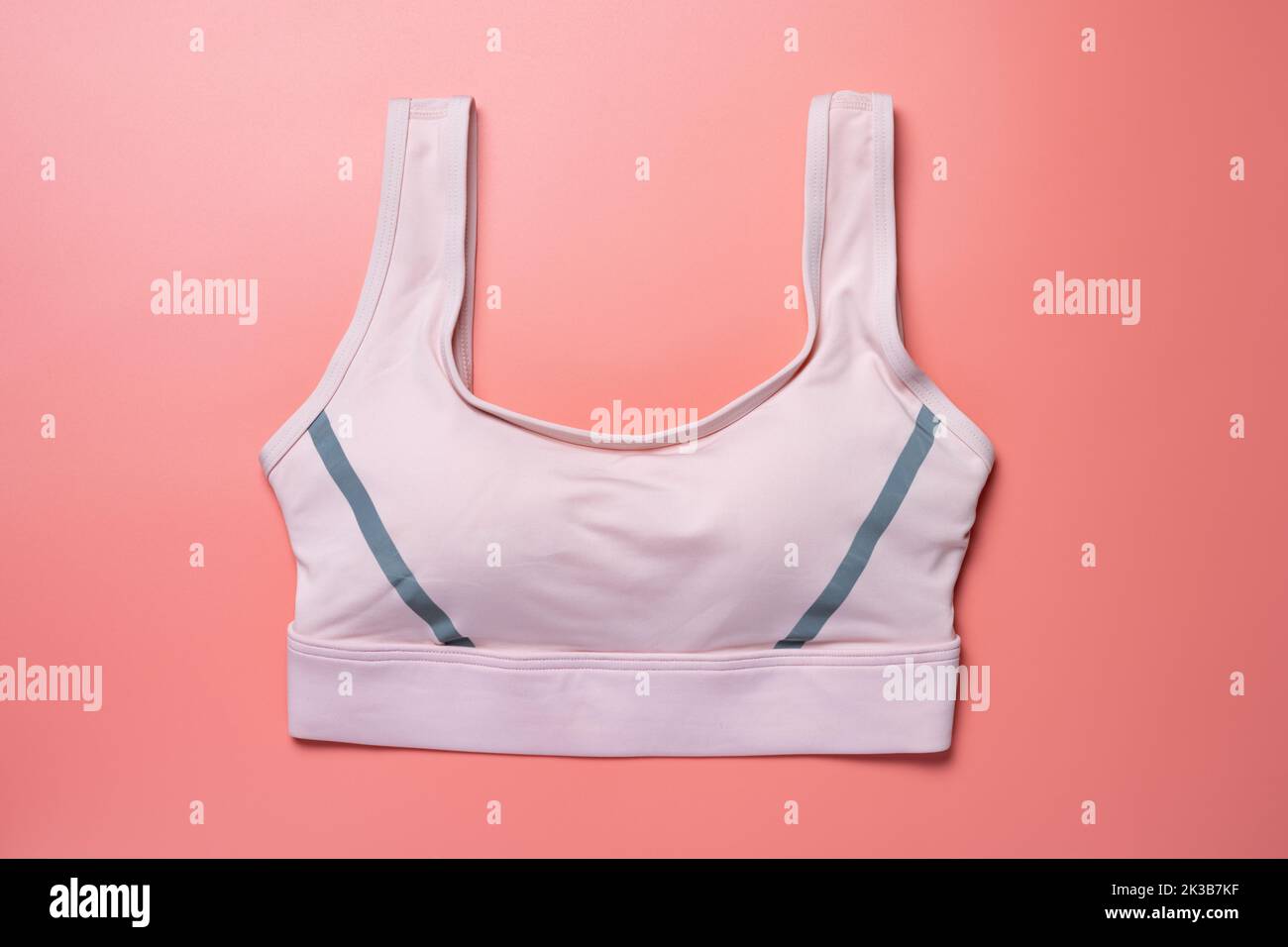 pink sports bra for women on pink background Stock Photo
