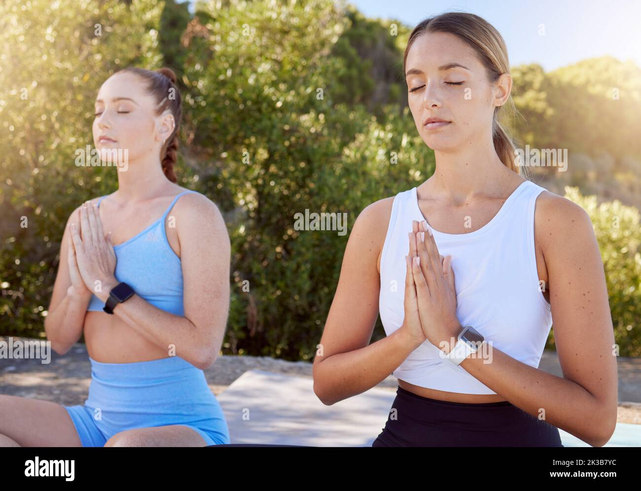 Yoga women, meditation and namaste praying for hope, zen and mindset in training, breathing and outdoor exercise. Calm, relax and focus fitness Stock Photo