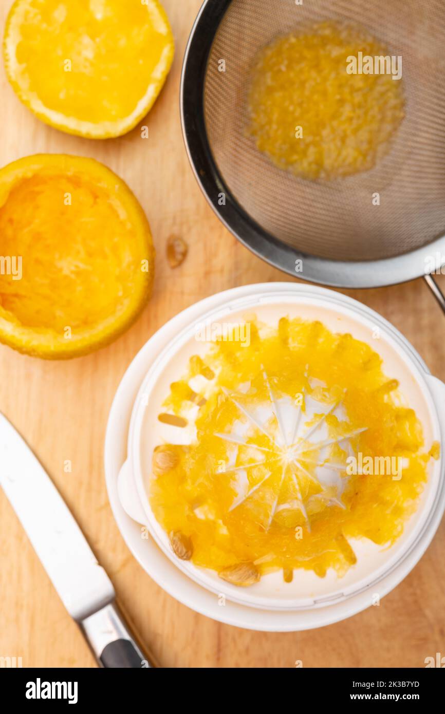making fresh orange juice at home vertical composition Stock Photo