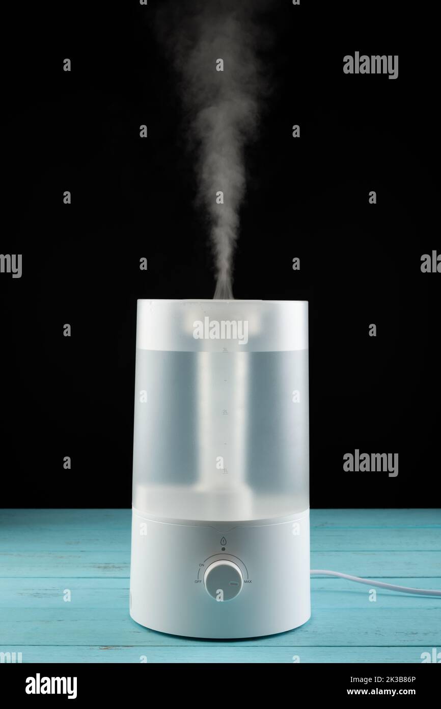 electric humidifier on a table vertical composition Stock Photo
