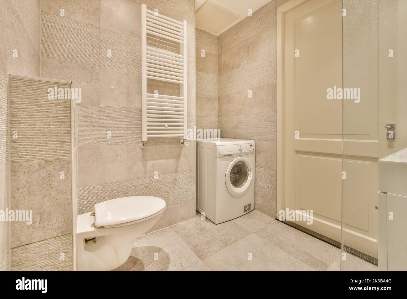 Glass partition between shower tap and wall hung toilet in modern