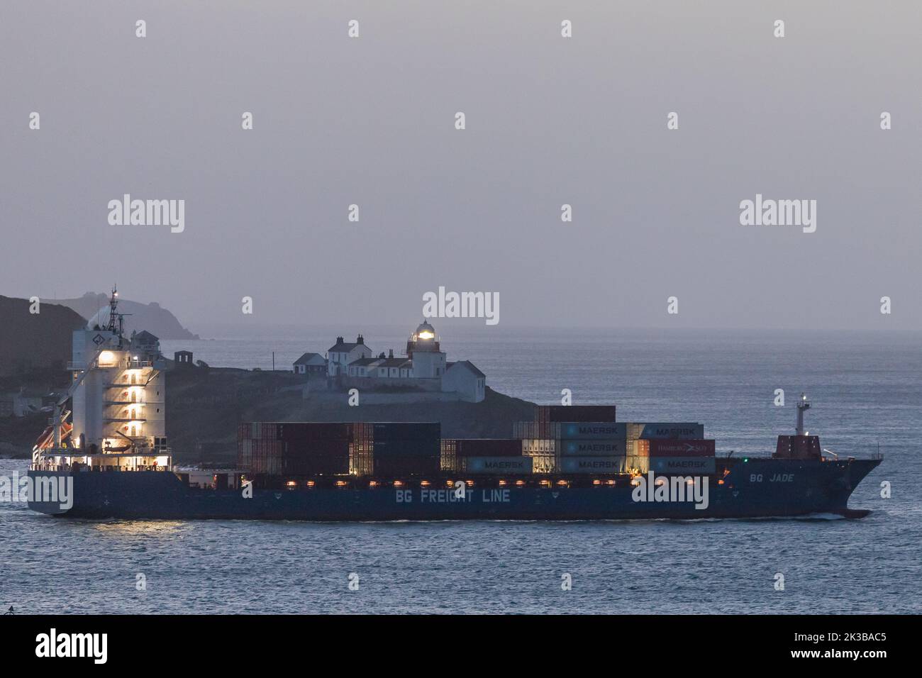 Roches Point, Cork, Ireland. 26th September, 2022. Bound for Rotterdam the container ship BG Jade leaves the harbour before dawn at Roches Point, Cork, Ireland. - Credit; David Creedon / Alamy Live News Stock Photo