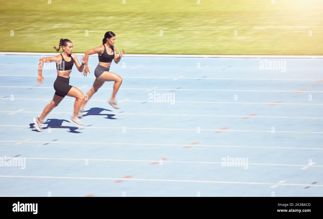 Sports, sprint runner women in competition on stadium with lens flare for power, speed and motivation. Professional athlete fitness people marathon Stock Photo