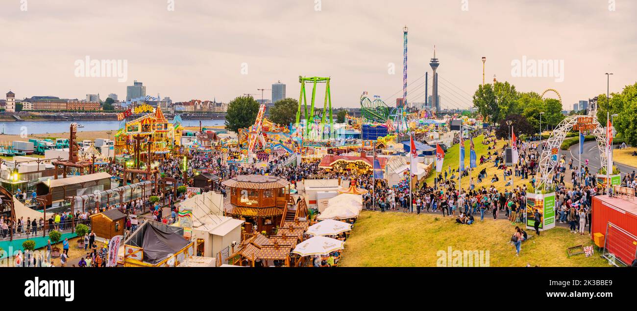 22 July 2022, Dusseldorf, Germany: An amusement fair and many eateries at a traditional festival on the banks of the Rhine river in Dusseldorf Stock Photo
