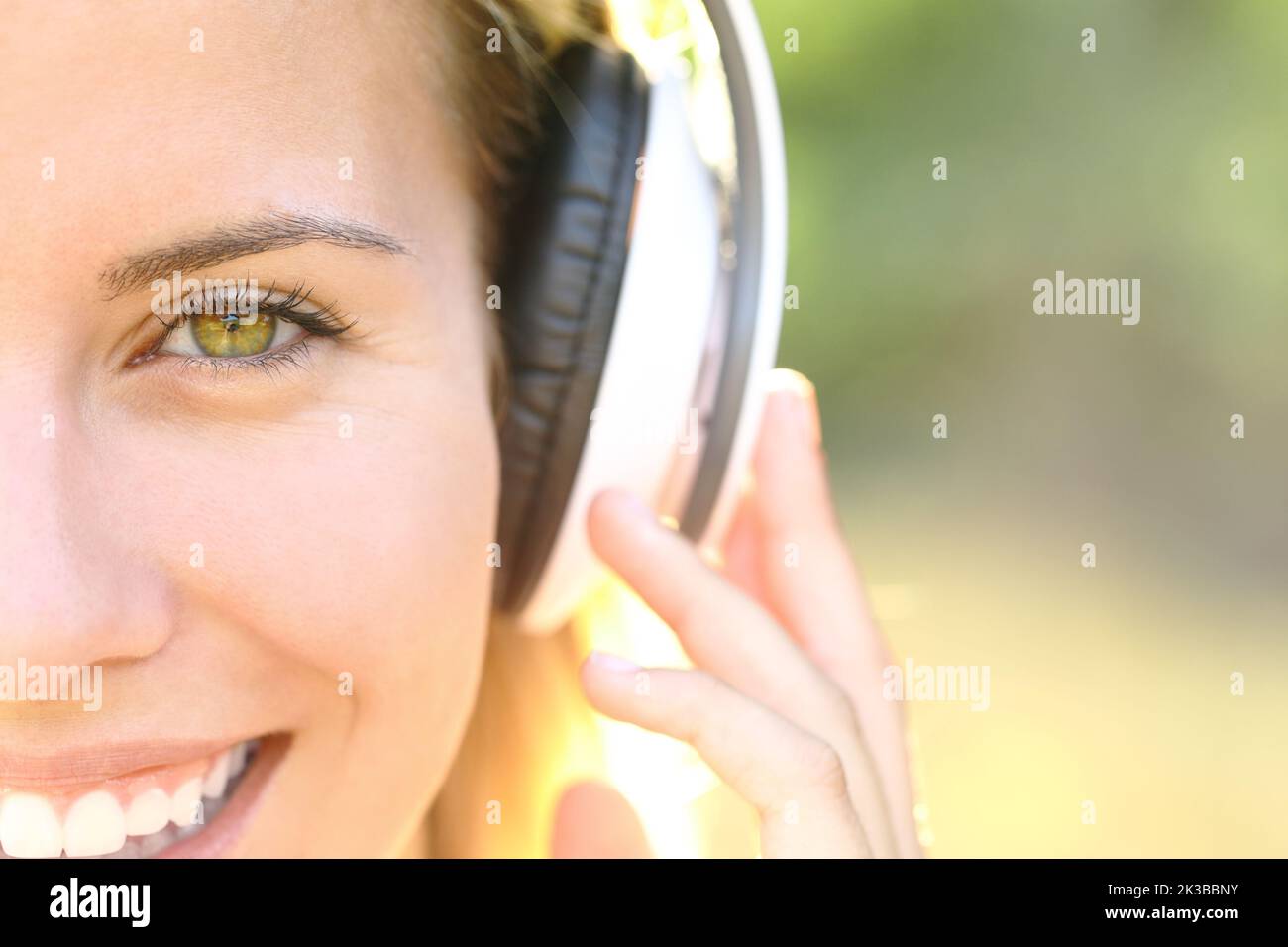 Listen Picture Front view portrait of a happy woman face listening to music with ...