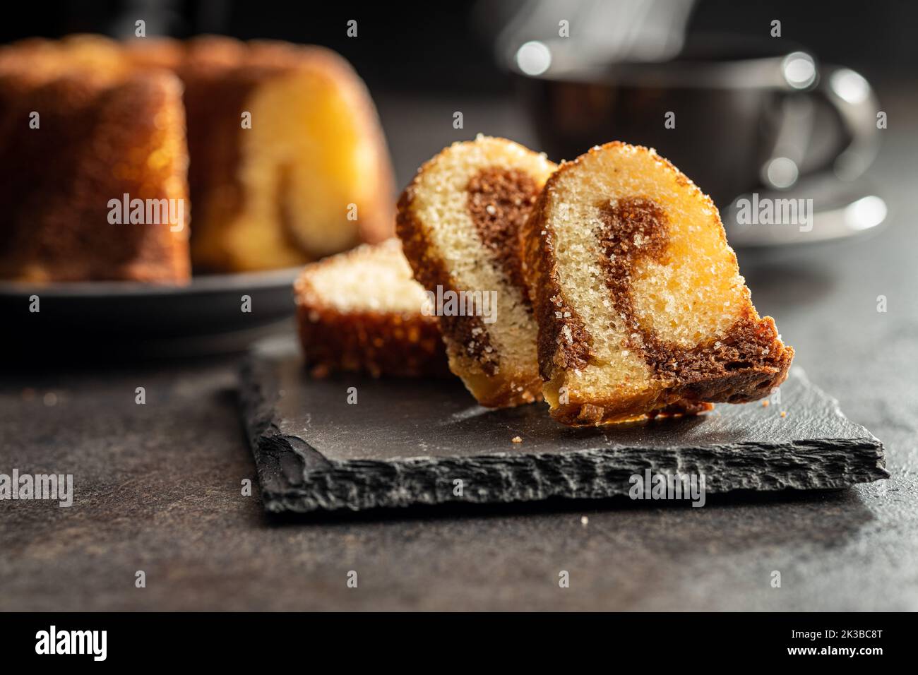 Sweet sponge cake. Bundt cake on the dark table Stock Photo Alamy