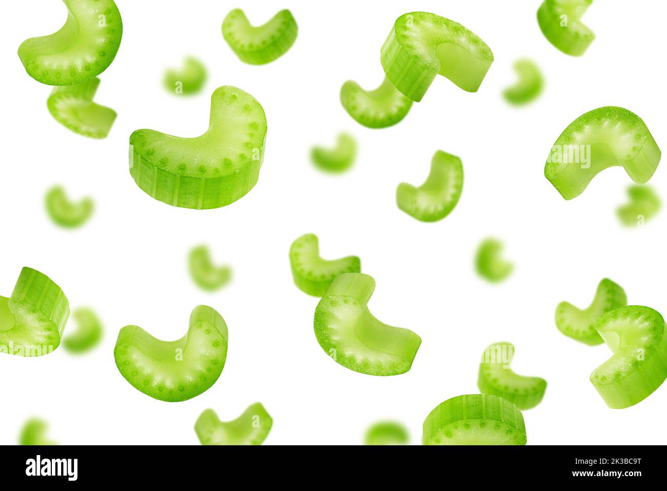 Falling celery slice isolated on white background, selective focus ...