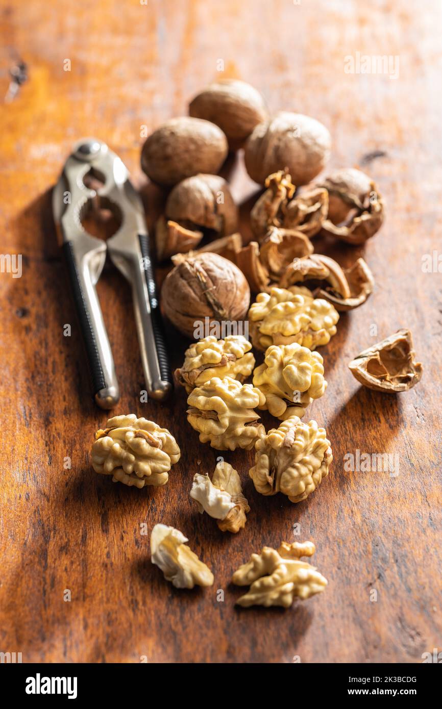 Peeled walnut on the wooden table. Stock Photo