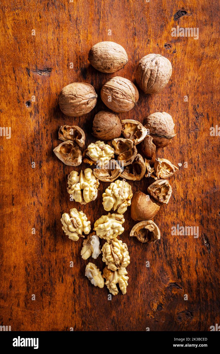 Peeled walnut on the wooden table. Top view. Stock Photo