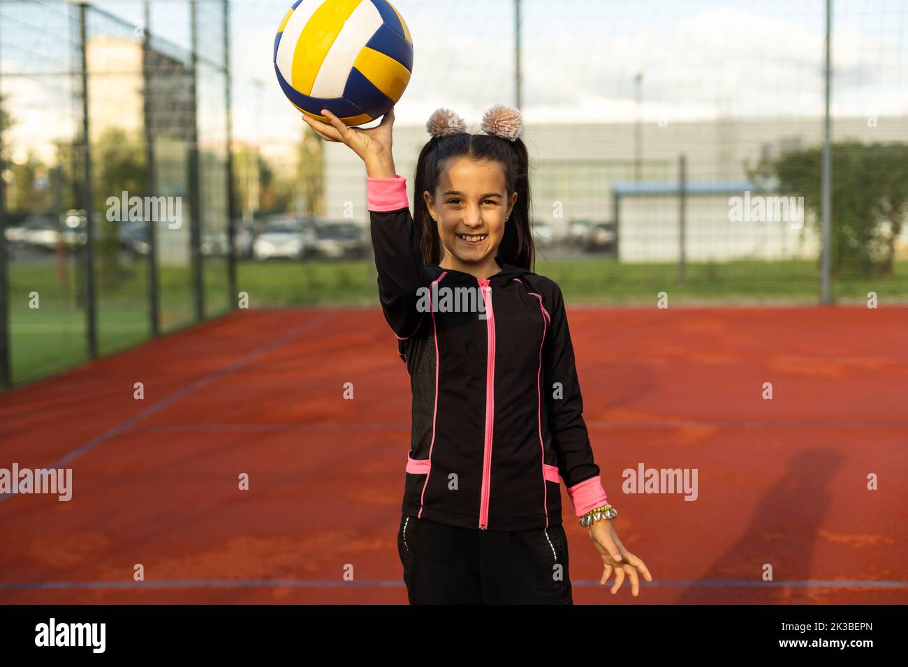 Pretty teen girl with brunette hair, volleyball ball Stock Photo - Alamy