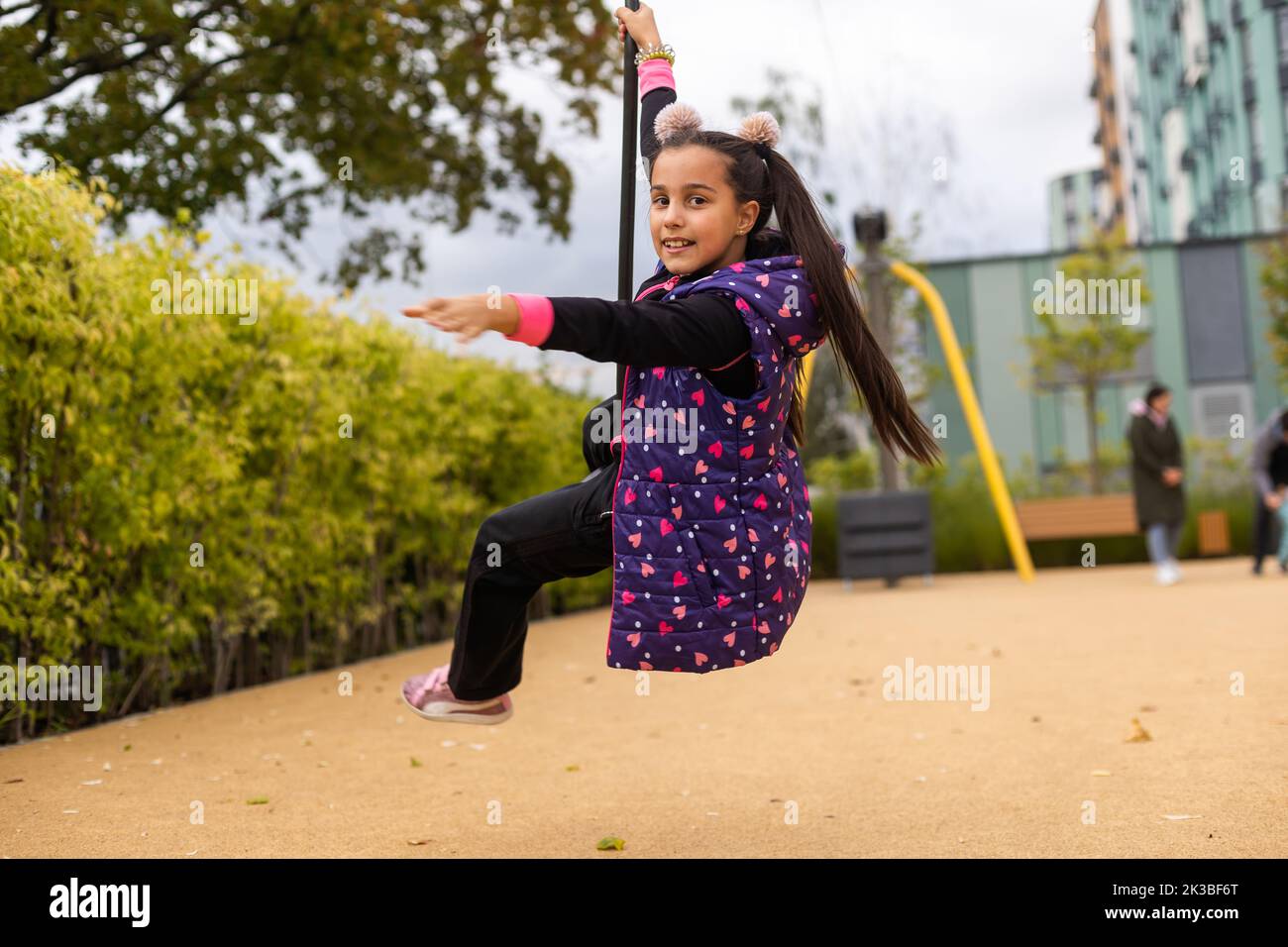 Little Girl Rushing Little girl rushes on a bungee Stock Photo - Alamy