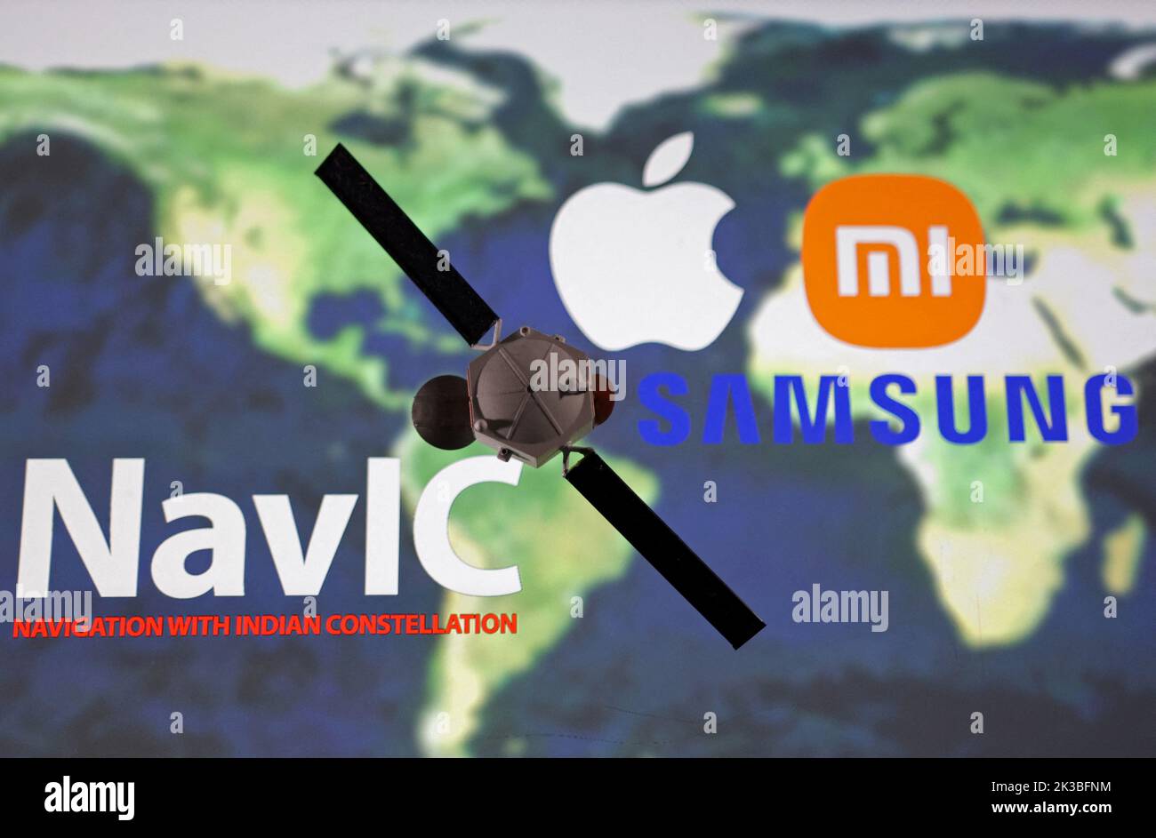 NavIC (Navigation with Indian Constellation), Apple, Xiaomi and Samsung logos are seen near Satellite model placed on the map in this illustration taken, September 25, 2022. REUTERS/Dado Ruvic/Illustration Stock Photo