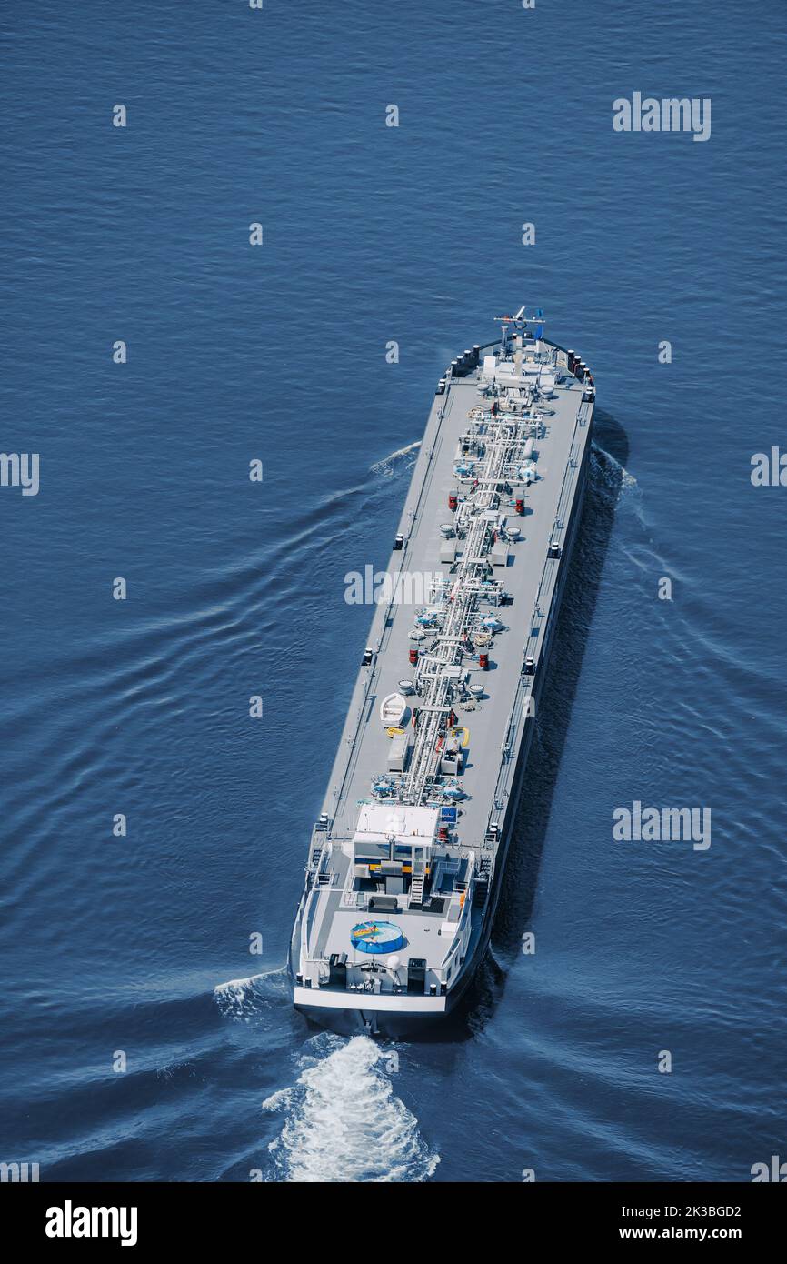 Aerial view of a large gas or oil tanker ship. Infrastructure and transportation of fuel and import of hydrocarbons Stock Photo